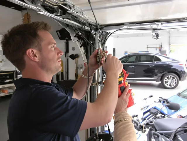 Shaker Heights Garage Door Repair safety certified technician performing cable replacement in Shaker Heights