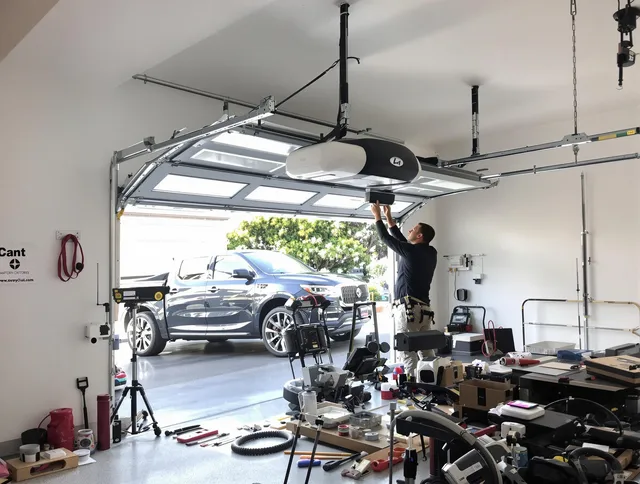 Shaker Heights Garage Door Repair specialist installing smart garage door opener system in Shaker Heights home